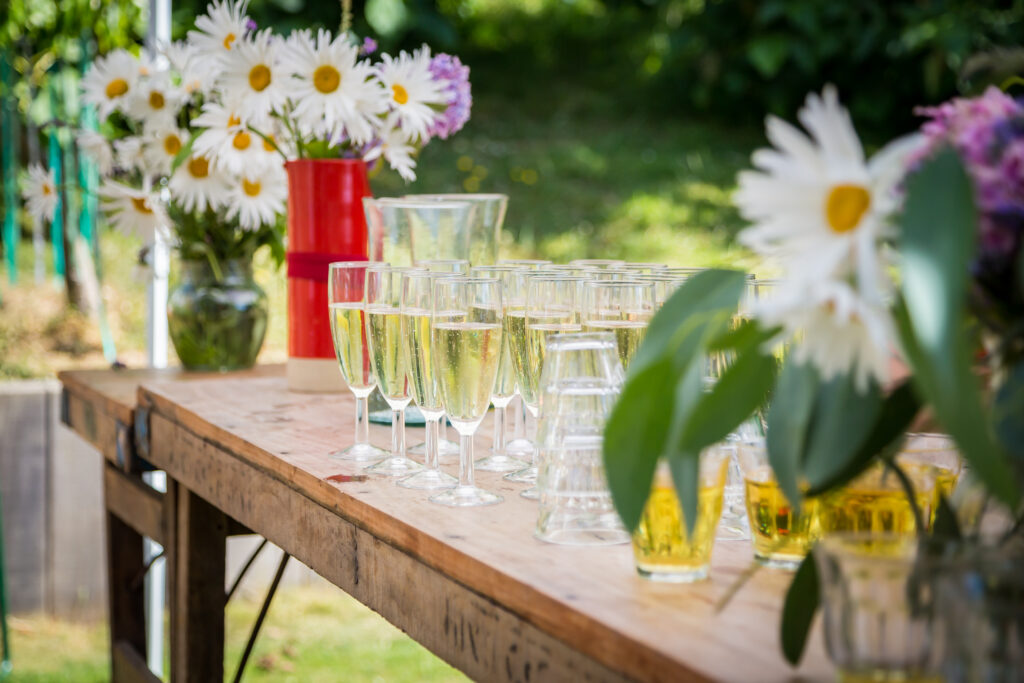 Drinks on a table with flowers outside